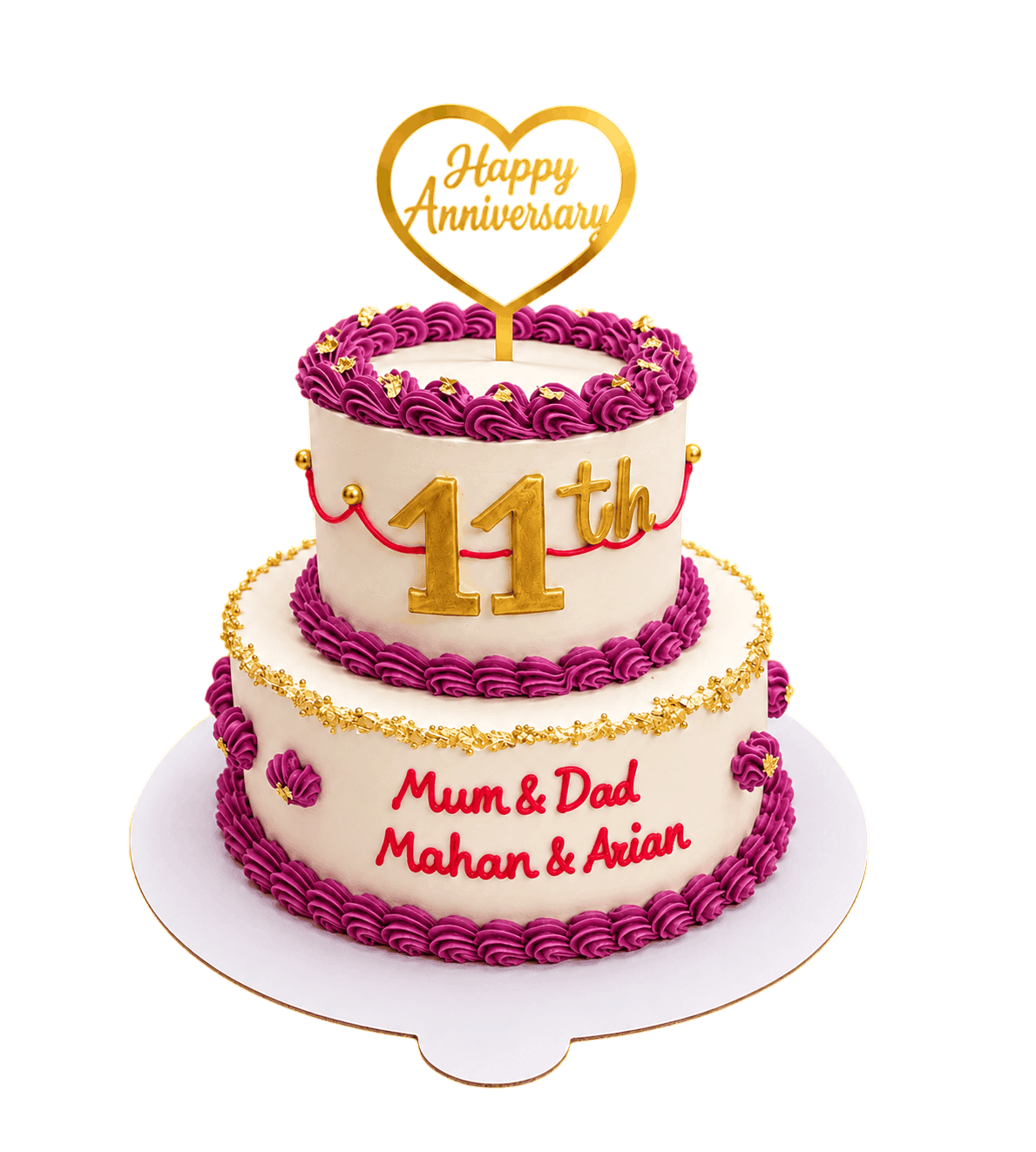 Pink heart-shaped cake with piped borders and purple butterflies